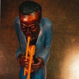 Miles in Blue , 90 “ x  16 “ Pine body , Osage trumpet , oil enamel. Can be seen at the Onset  School  of Music  in Wakefield.